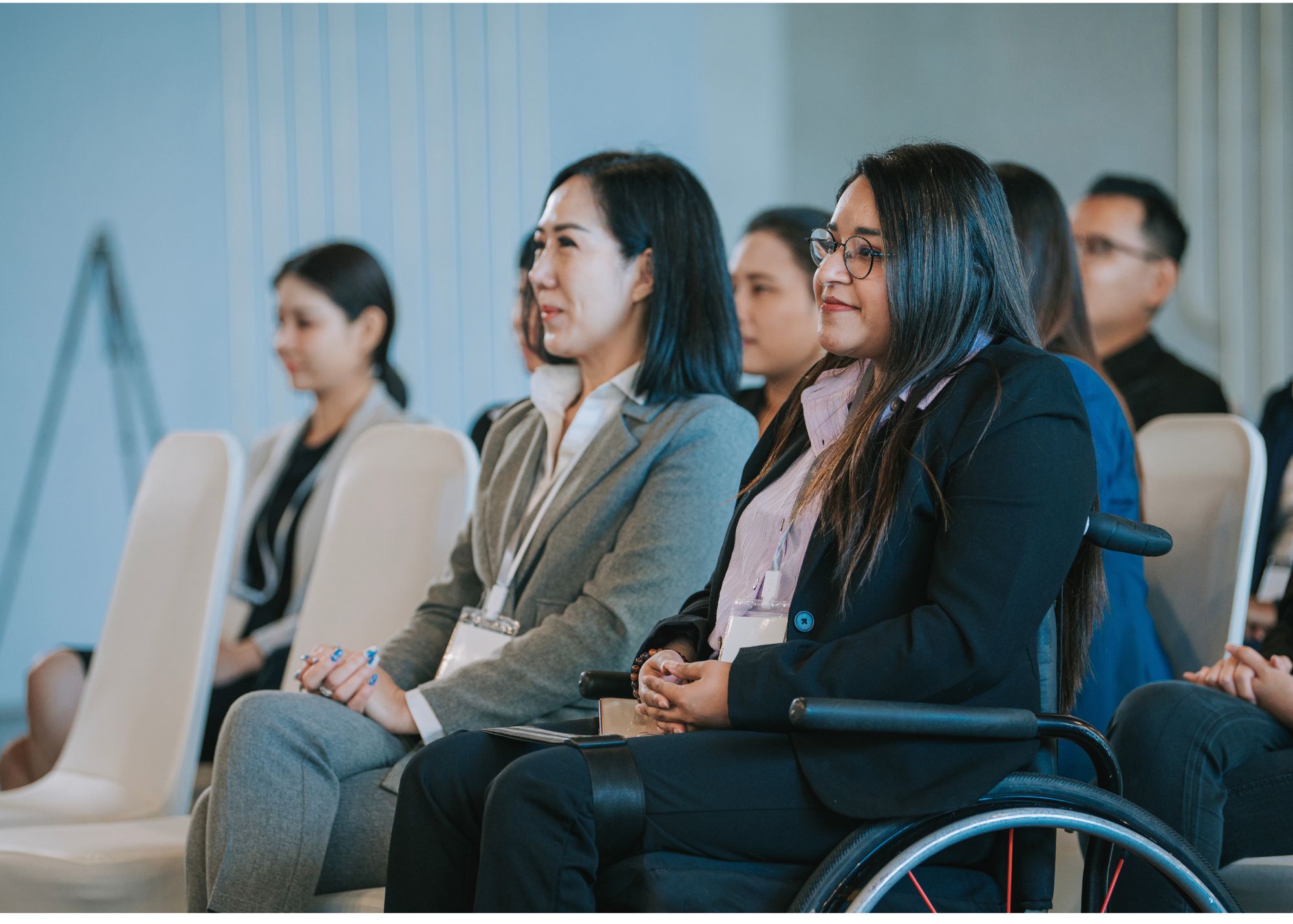 Woman attending entrepreneur conference in wheelchair